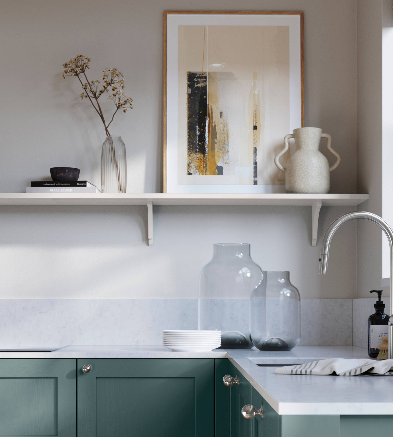 Wardley Morris Blue kitchen cabinetry with steel knobs, steel tap, white marbled worktop and matching backsplash. An open shelf on the wall above cabinets with ceramics and a vase of flowers.