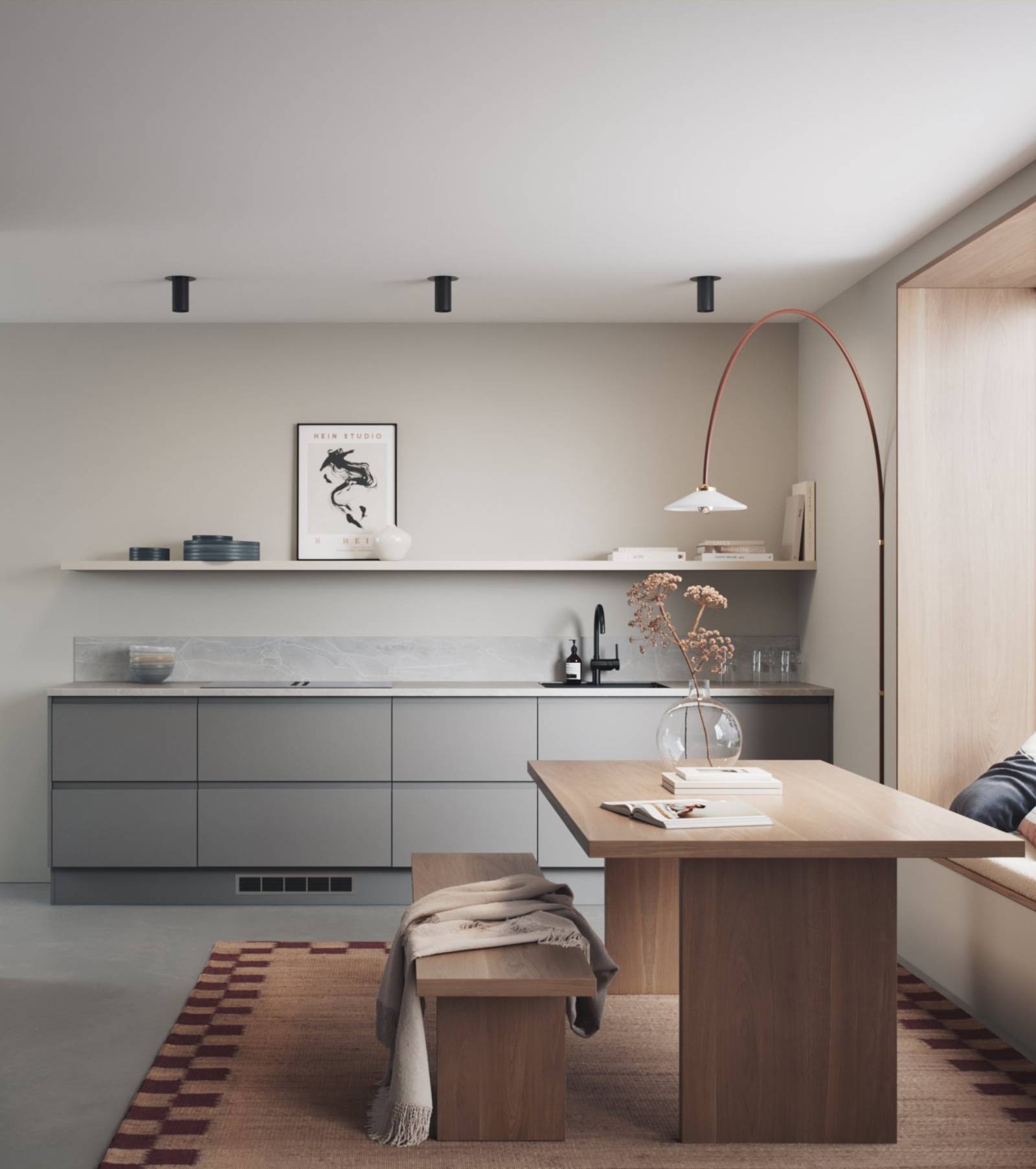 Mellomgrå kjøkken med integrerte grep, før en innredninsløsning som er lineær og grafisk velskapt, med tre spisebord och sittbænk