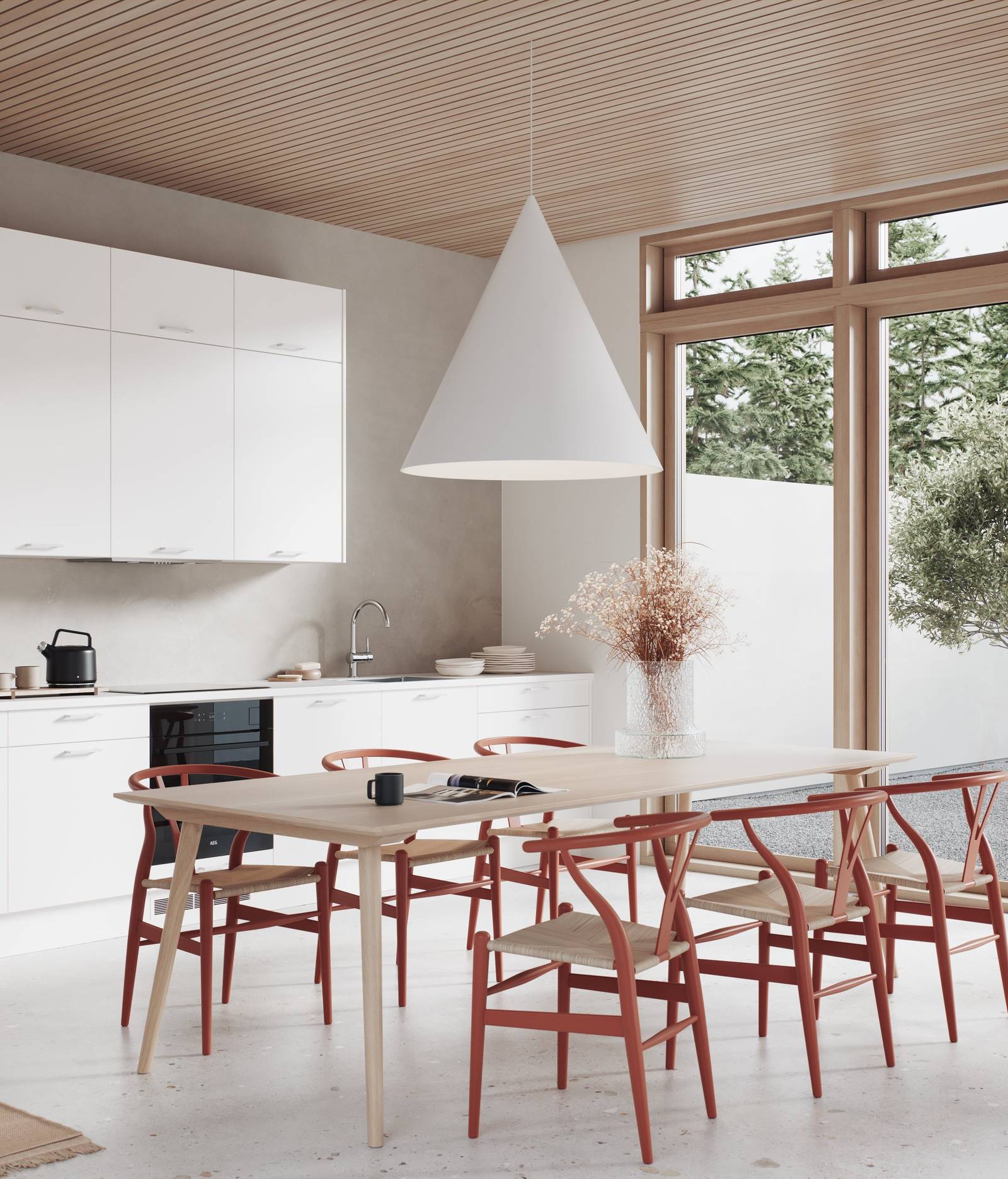 Modern kjøkken med slette og slitesterke melaminbelagte lys alm fronter, spisebord i lys tre og rød stoler.