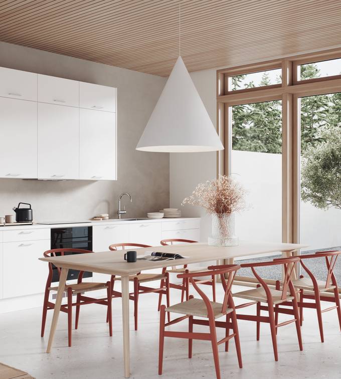 Modern kjøkken med slette og slitesterke melaminbelagte lys grå fronter, spisebord i lys tre og rød stoler.