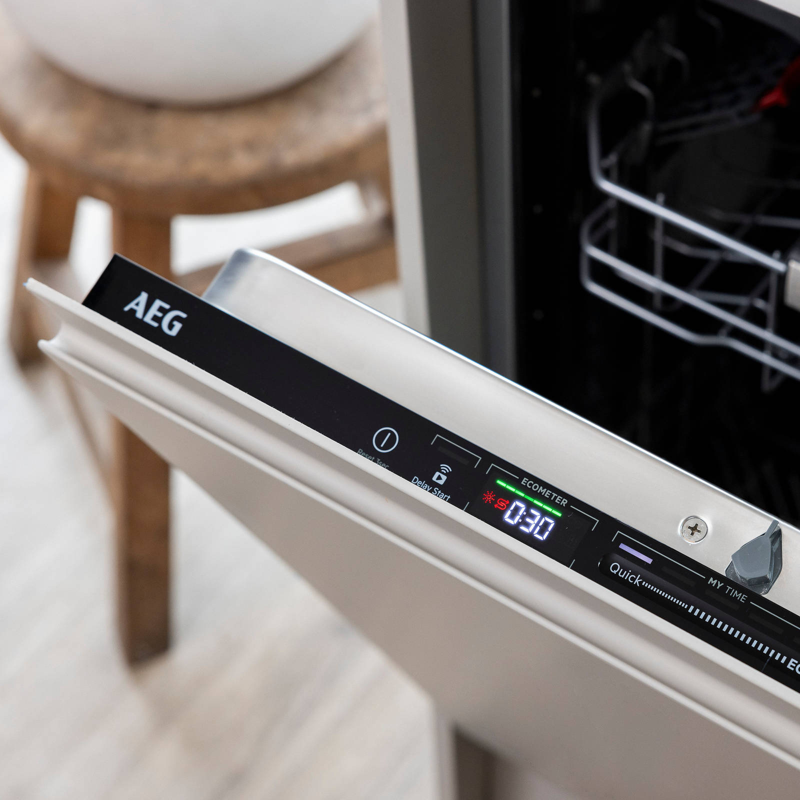 Close-up displays and settings interface of opened integrated AEG dishwasher in Yasmin Wyatt's Luna Kitchen from Magnet