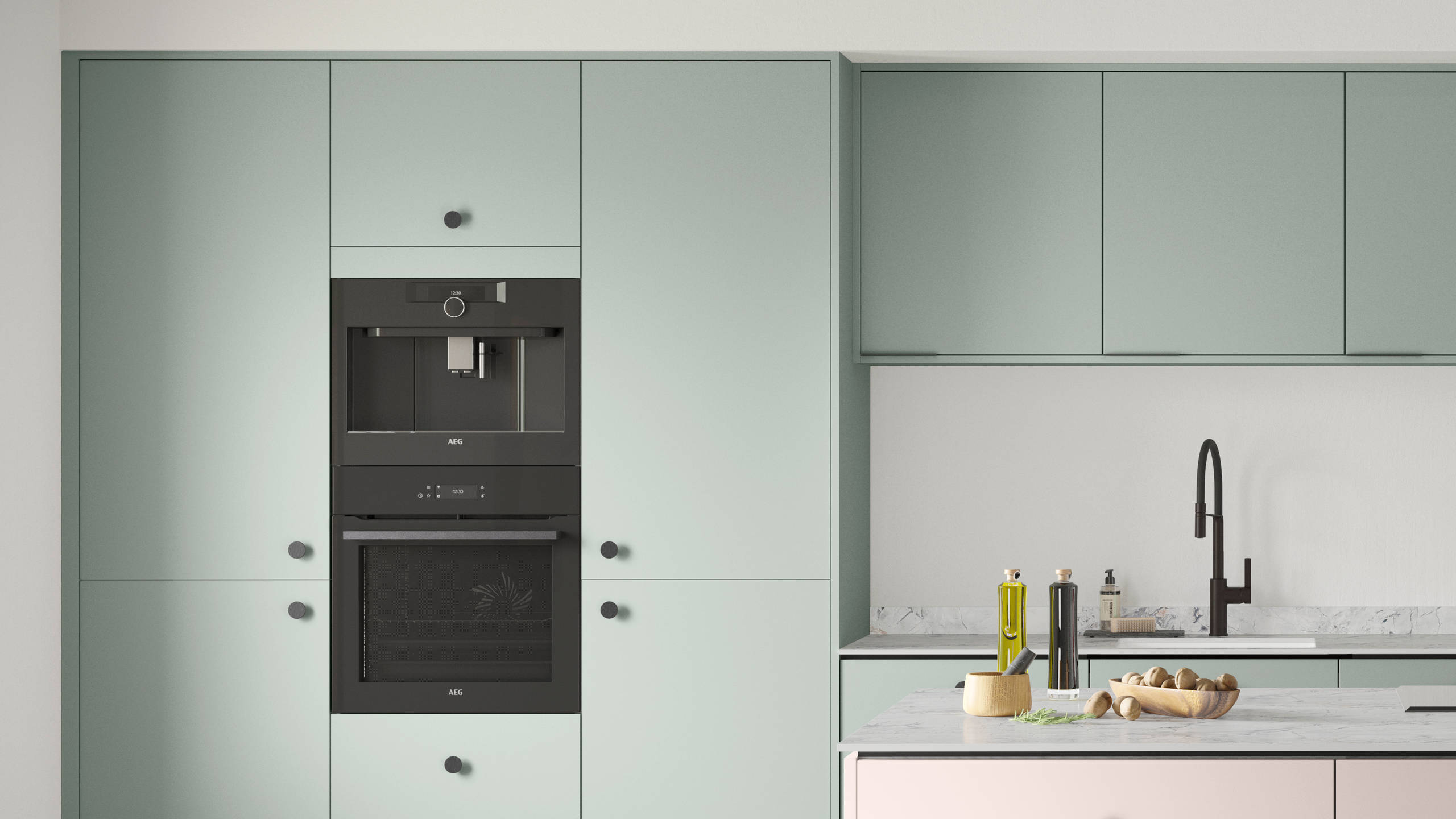 Soho Seagrass kitchen with Rose bowl kitchen island, a premium painted slab door from Magnet.