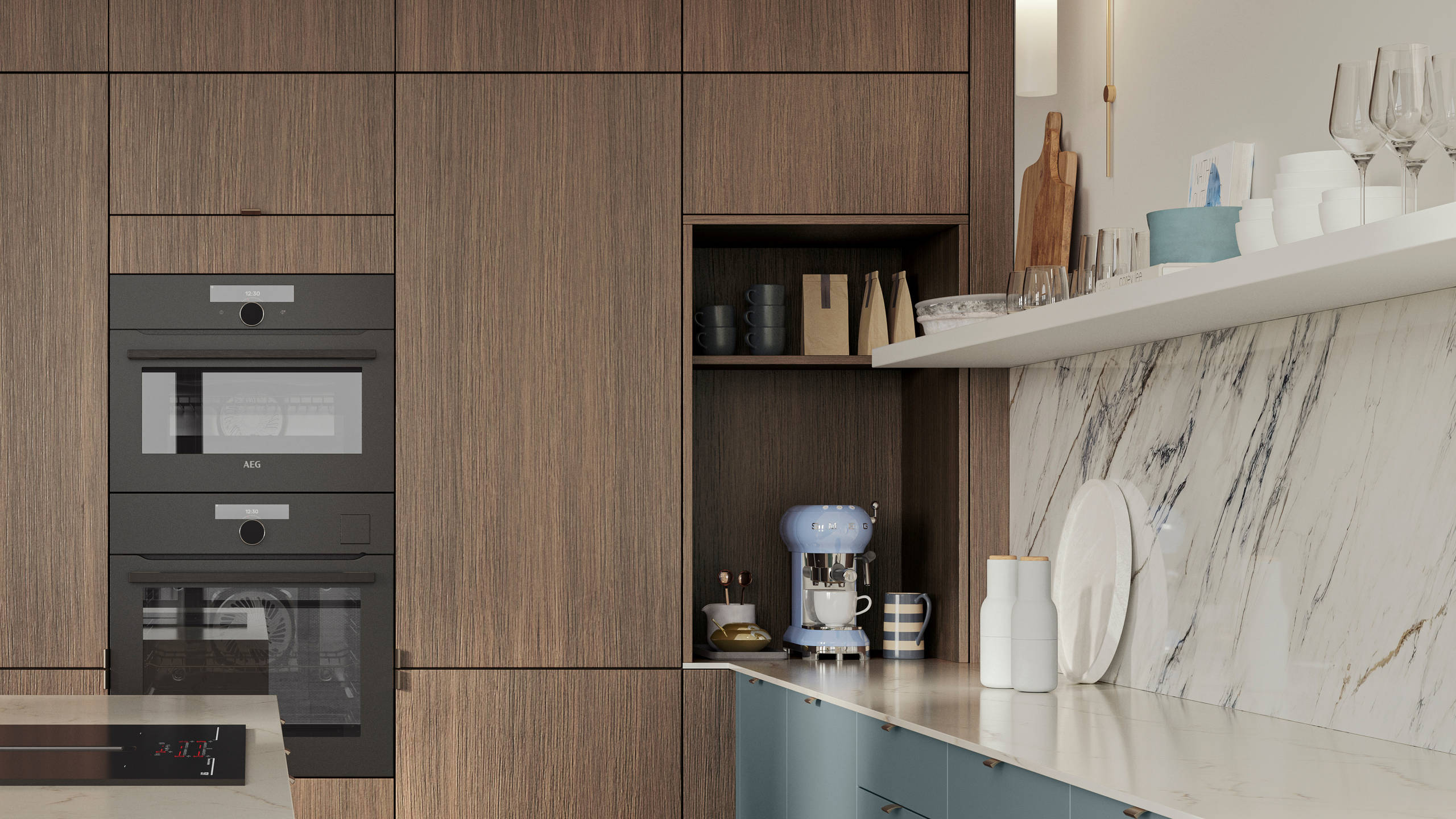 Soho Duck Blue kitchen from Magnet combined with ovens integrated into tall Nordic Nature cabinetry, white marble splashblack, paired beautifully with a bright brass tap and sink.