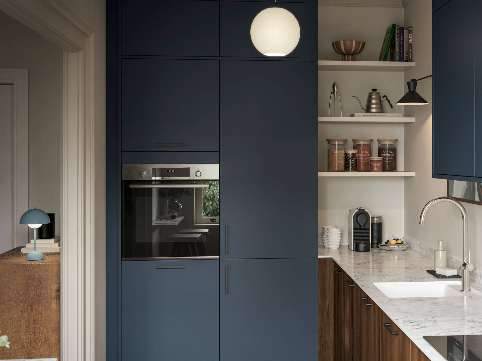 Contemporary Ascoli Mineral Blue tall cabinets and wall cabinets over Portobello Umbra kitchen cabinets with marbled compact laminate worktop, black handles and Amtico smouldered oak herringbone flooring.
