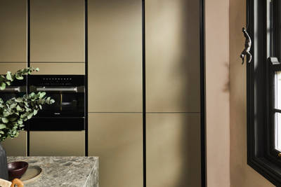 Tall modern slab Soho Balmoral cabinets, containing integrated refrigerators.