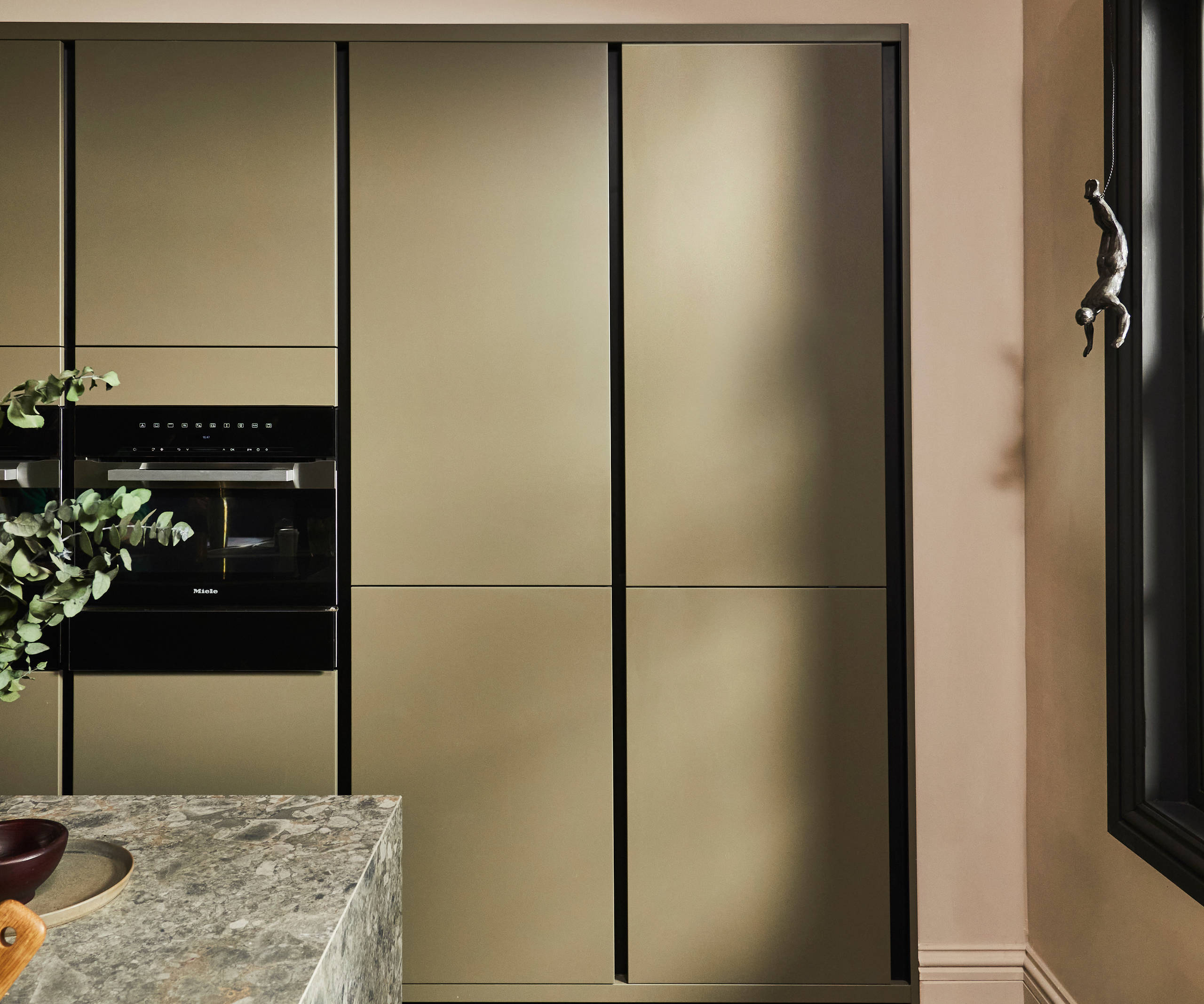 Tall modern slab Soho Balmoral cabinets, containing integrated refrigerators.