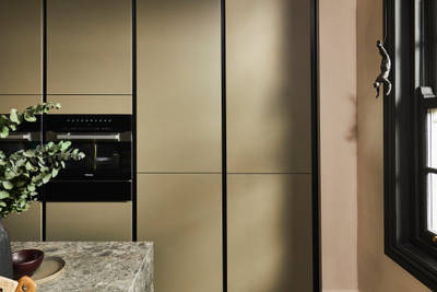 Tall modern slab Soho Balmoral cabinets, containing integrated refrigerators.
