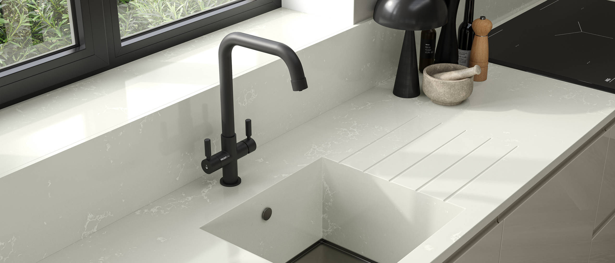 Close-up of black tap in large integrated Minerva kitchen sink bowl in Minerva worktop with matching splashback, black metal frame windows and black accessories in contemporary Luna Gloss Limestone kitchen