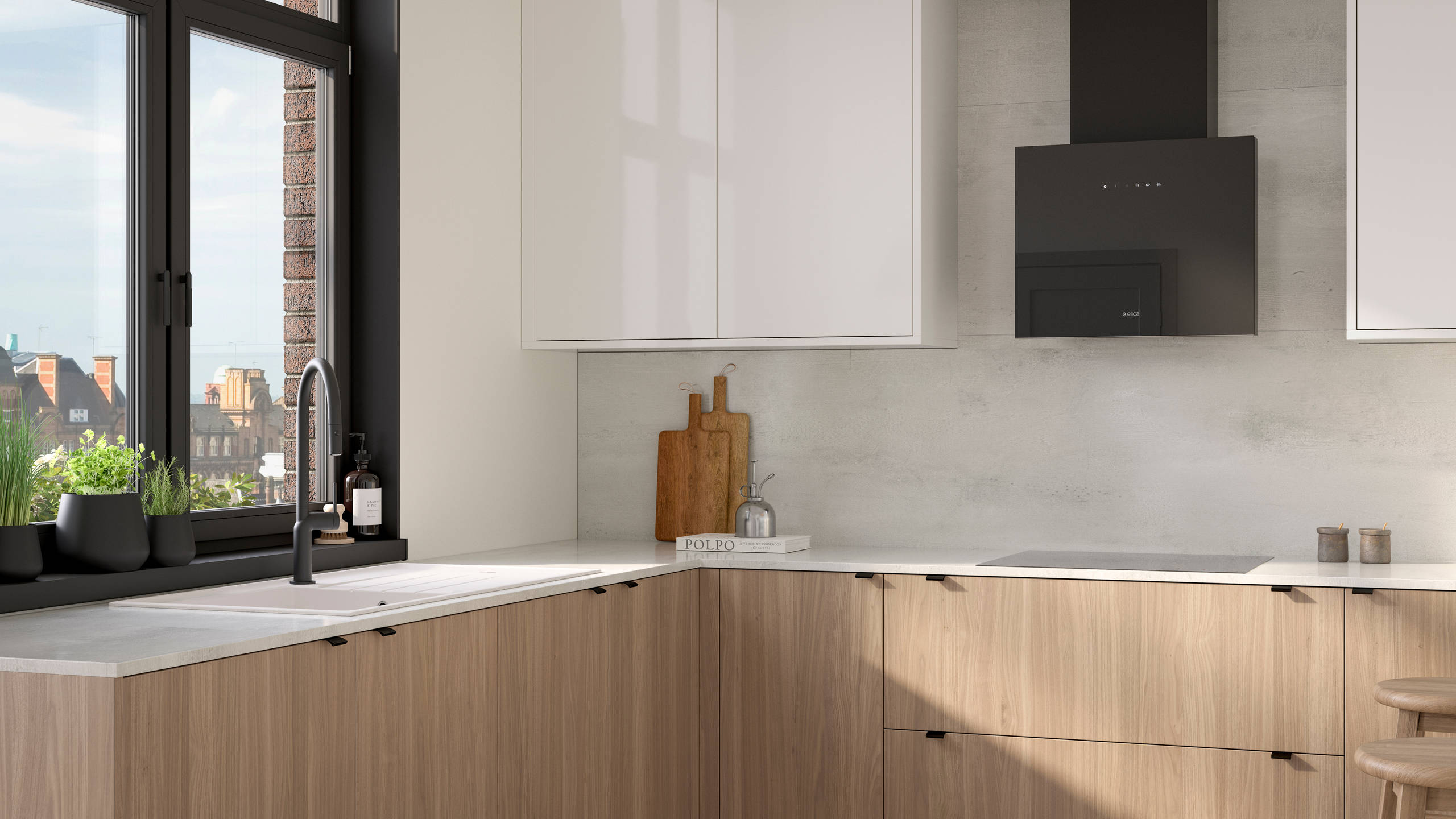 Ascoli kitchen from Magnet with Natural Oak cabinetry, a white worktop, Ascoli Gloss white wall cabinets over countertop paired with matching black handles, tap, hood and window frame over white sink.