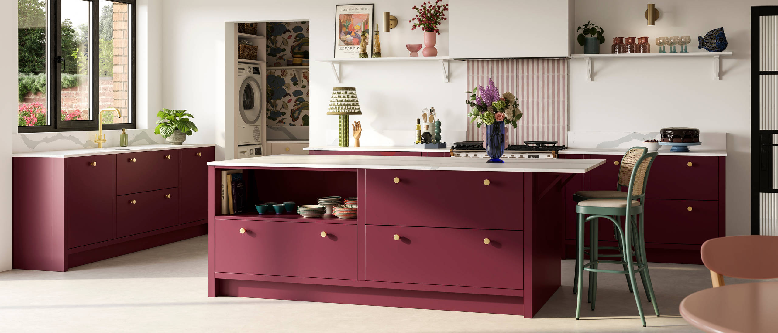 Modern slab front Soho Morello kitchen, kitchen island with rattan bar stools at breakfast bar, Bianco calacatta worktop and upstand, brass knobs and open shelf in kitchen island holding eclectic eramics, utility room with matching Soho cabinetry in the shade  Shell.