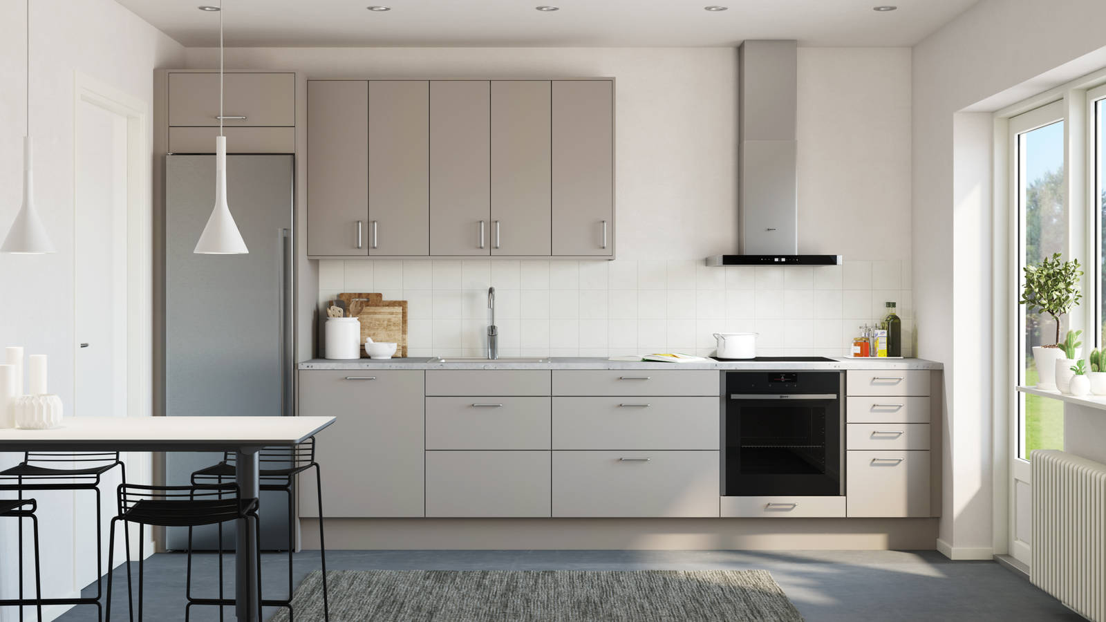 Tidlösa och stilrena Arkitekt Plus från Marbodal i greige kulör Frö, integrerade ugn och kyl/frys i rostfritt stål.