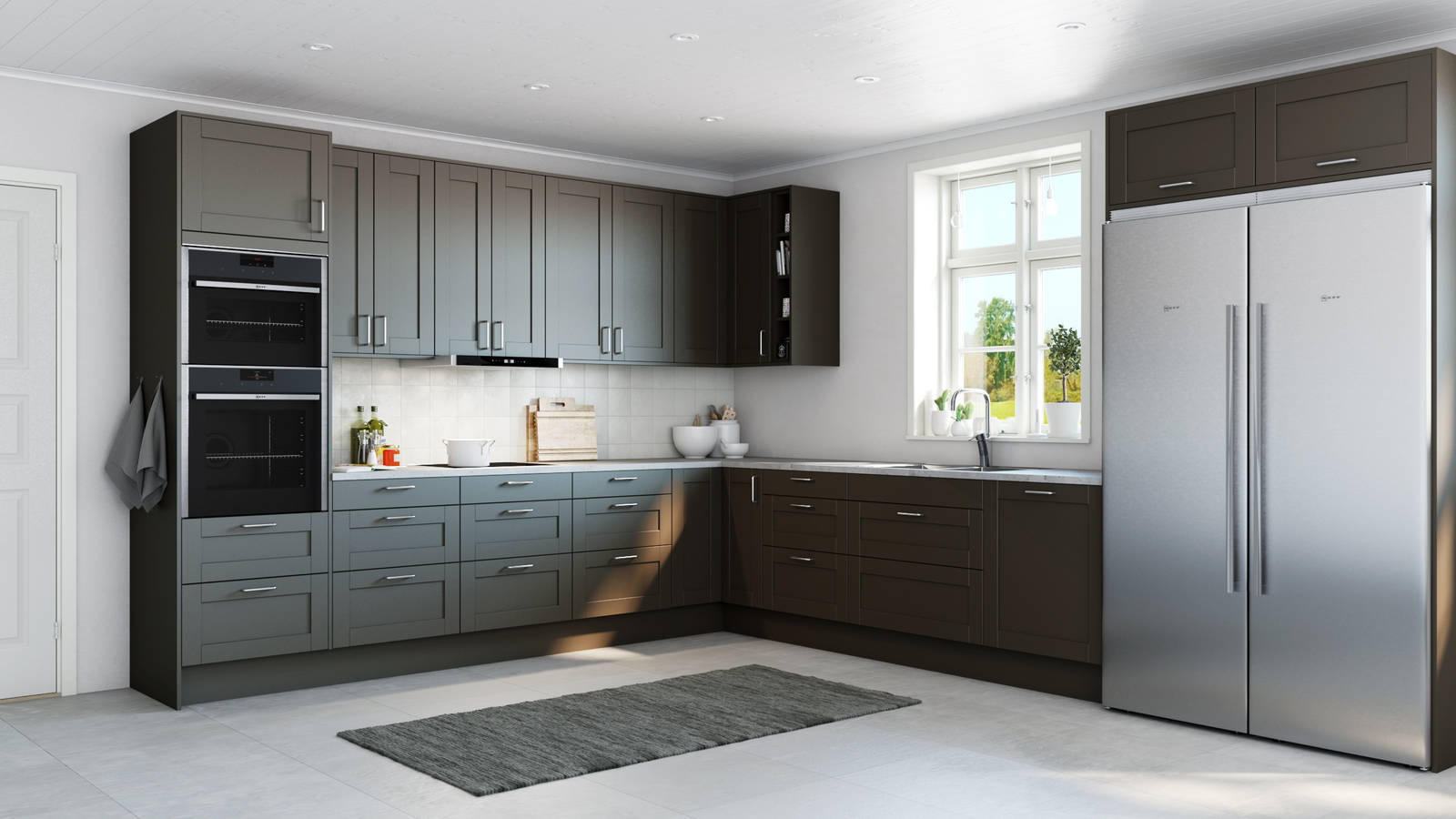 Det mysiga och romantiska köket Form, en ramlucka med slät spegel, i den bruna kulören Bark, med integrerade ugnar och kyl/frys i rostfritt stål.