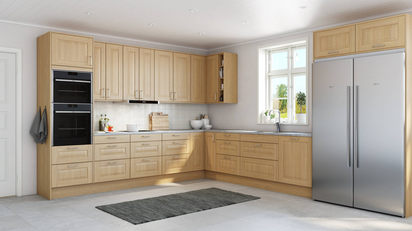 Köket Lindö med klassisk och exklusiv spegellucka, i ek, med integrerade ugnar och kyl/frys i rostfritt stål.