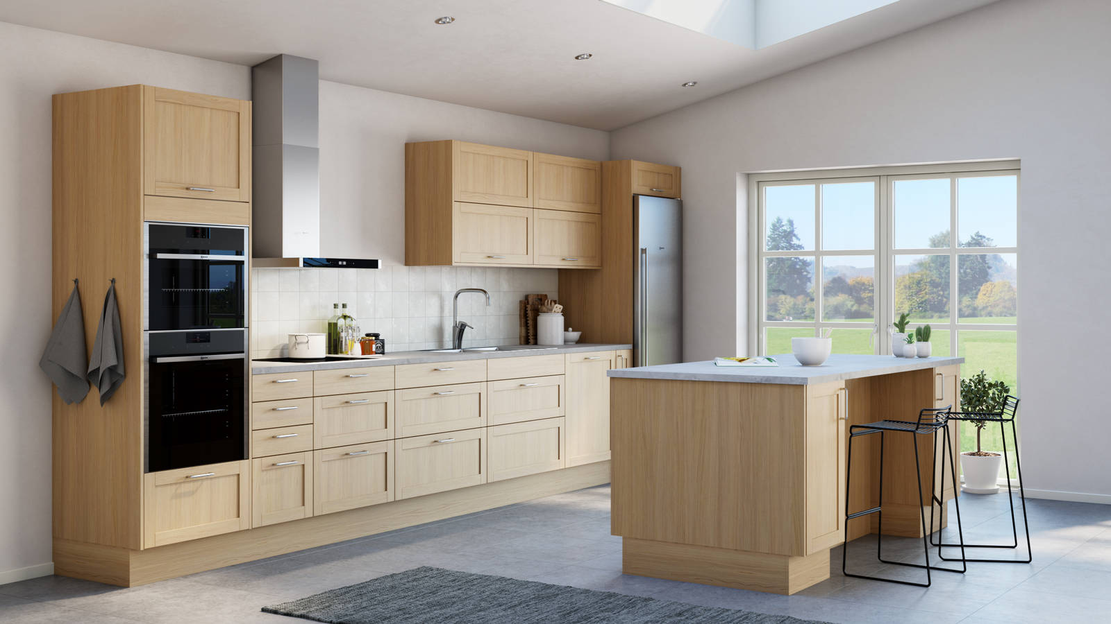 Ett kök i Ramsvik Ek från Marbodal, med köksö och grå laminatbänkskiva