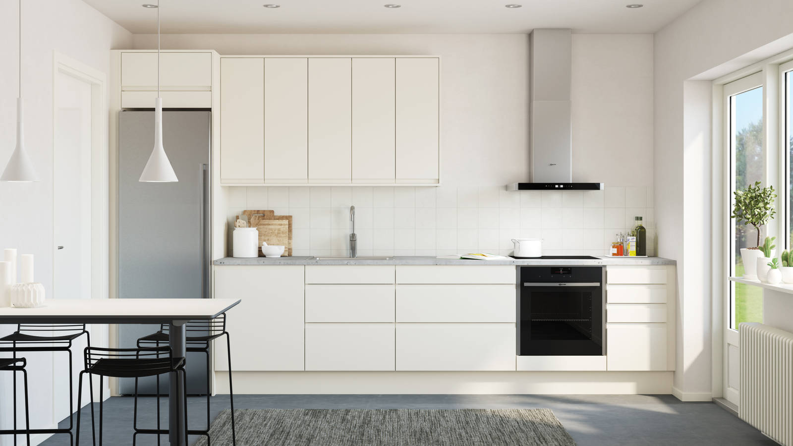 Viken Frost, ett vitt handtagslöst kök med integrerade grepp i luckan.