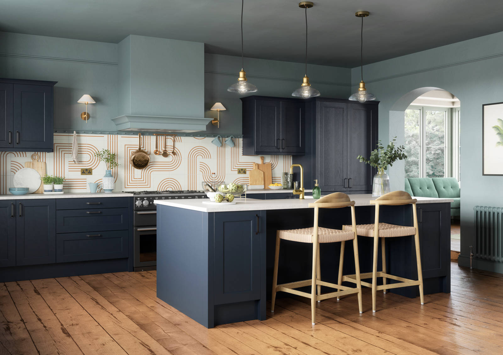 Modern country-style Ludlow kitchen in dark blue shade Midnight, with lighter blue walls, wooden floors and wooden barstools by kitchen island.