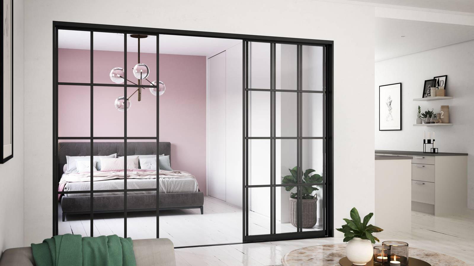 Glasskydedør med sort metalramme mellem stue og soveværelse