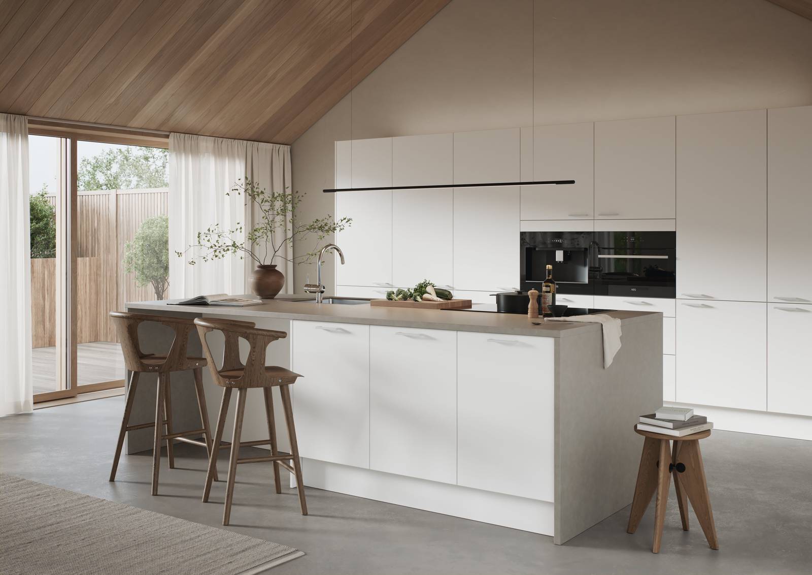 Hvit kjøkken med slank og elegant front med svakt avrundede kanter