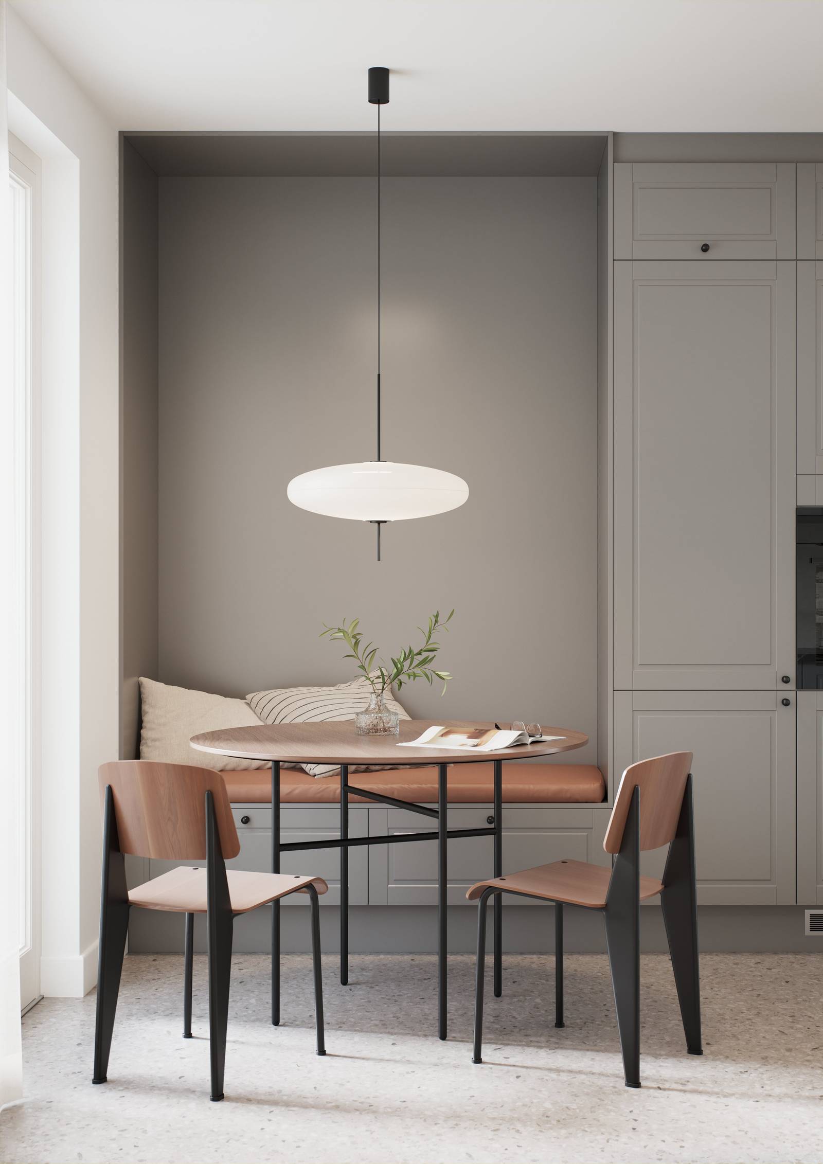 Ett tidlöst och modernt mellangrått kök med frästa spegelluckor som ger köket klassiska detaljer utan att vara rustikt, ett matbord i trä med svarta ben.