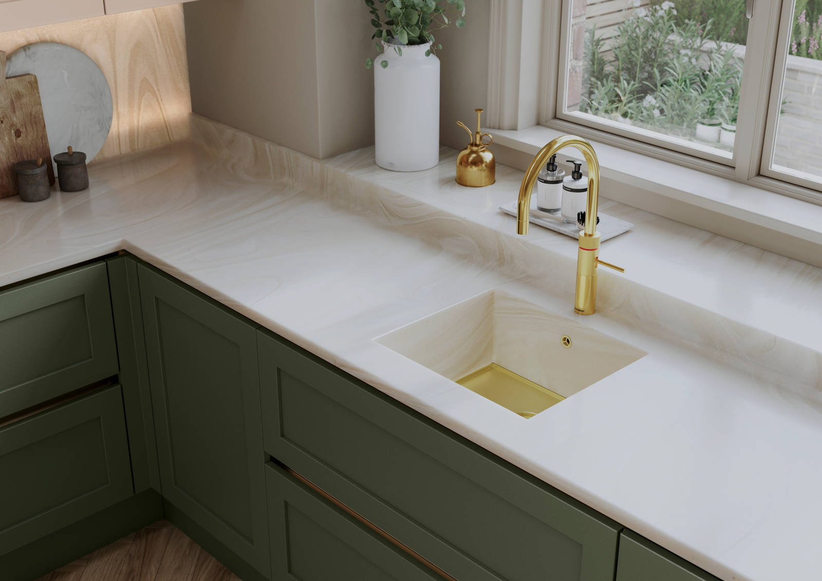 Overhead view of Integra Wardley in shade Misty Moors, with a white worktop and sink, paired with a brss kitchen tap.
