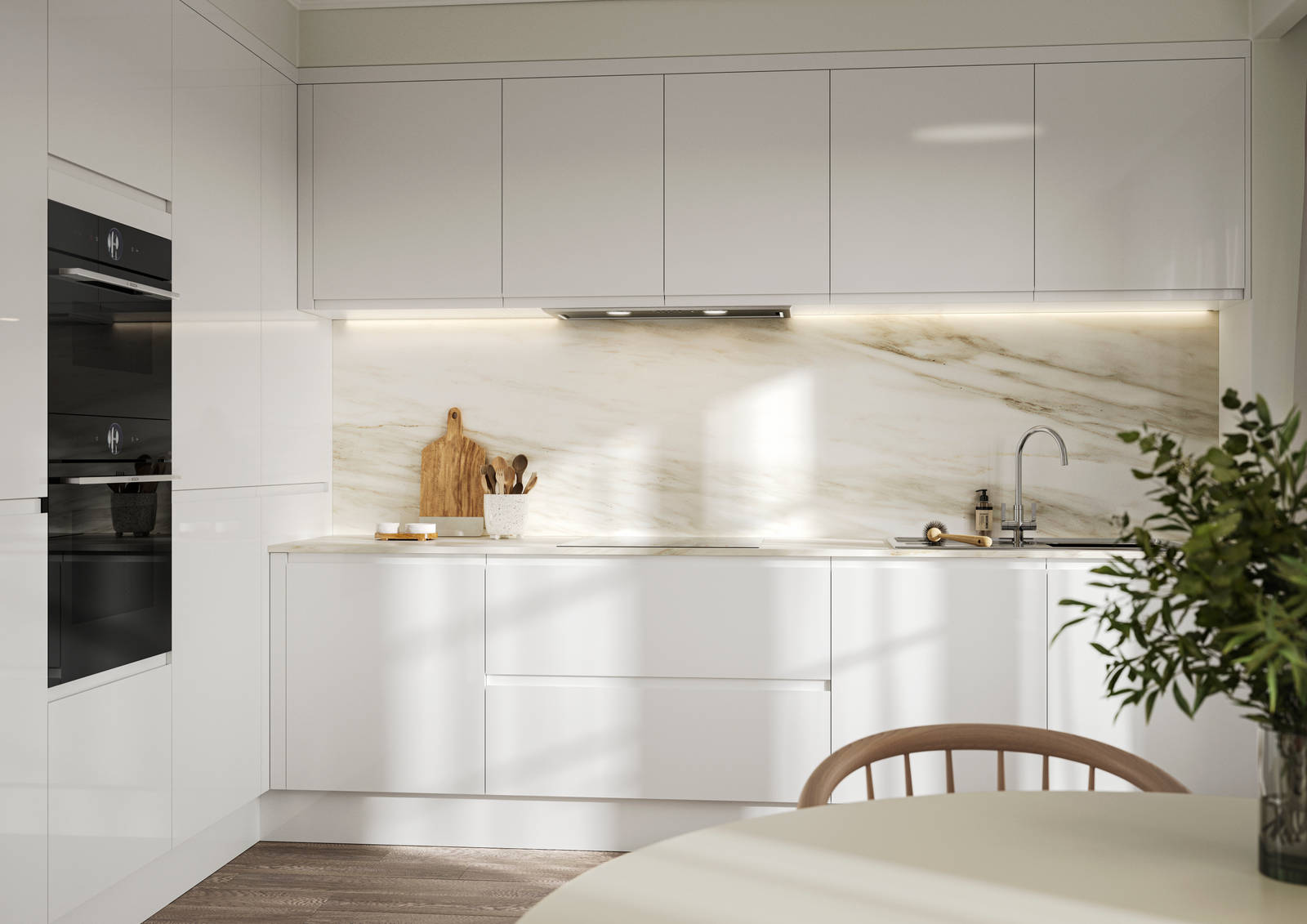 Handleless white gloss Luna kitchen from Magnet, with a white marbled worktop and backsplash.