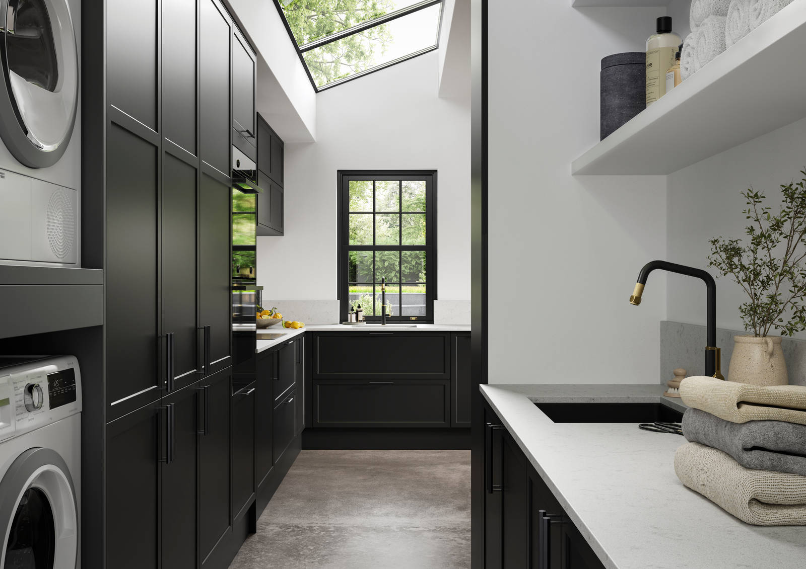 View of Modern Shaker kitchen Brunswick Sumi Black from laundry room, with integrated laundry machine and dryer, a work area with a black sink and tap,  black hex handles on cabinets and white worktop and splashback Silestone Miami Vena.