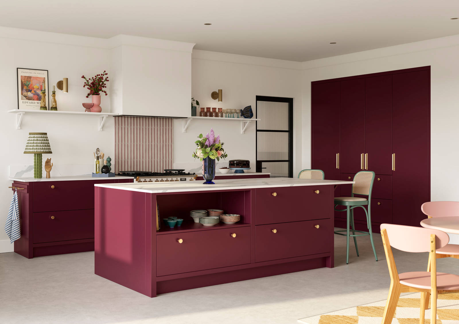 Modern slab front Soho Morello kitchen with built-in tall cabinets hiding integrated refrigerator, kitchen island with rattan bar stools at breakfast bar, Bianco calacatta worktop and upstand, brass knobs and open shelf in kitchen island holding eclectic eramics.