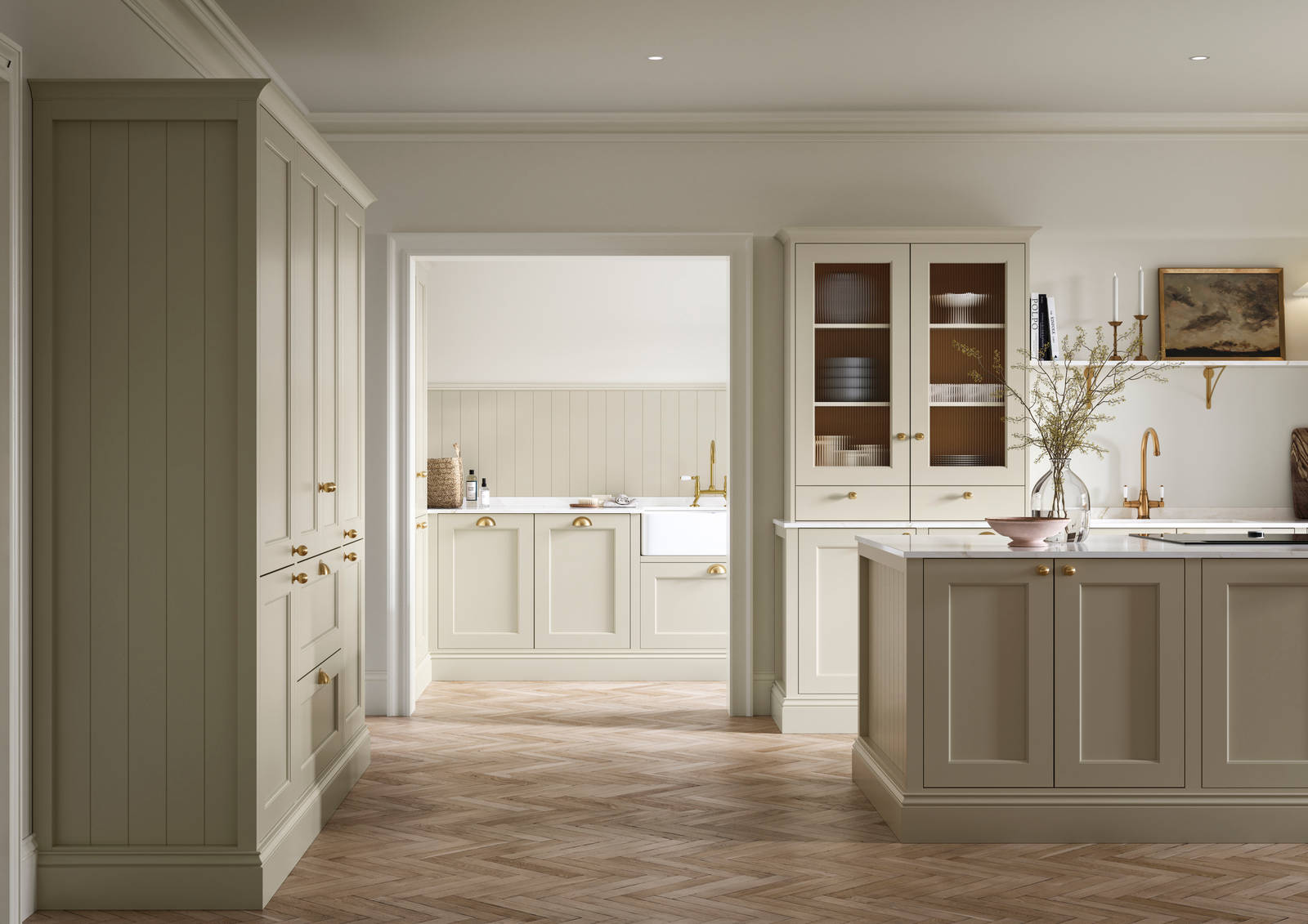 Open plan living room and Traditional Shaker-style kitchen Ludlow Parchment and view of utility room with white ceramic trough door frame, Goodrich Natural Oak herringbone engineered flooring, brass handles, brass knobs and bras tap.