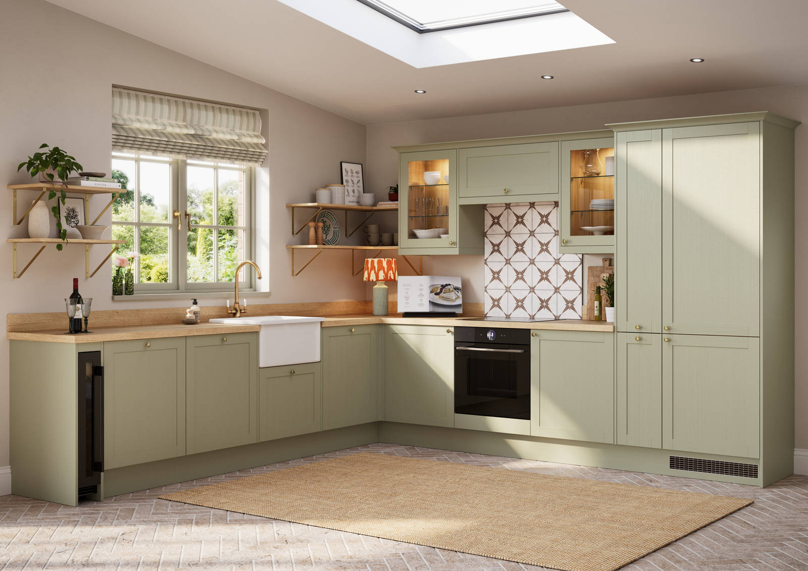 Contemporary Shaker kitchen Ambleside from Magnet in sage green shade Meadow with belfast sink, aged taps and wooden effect worktop.