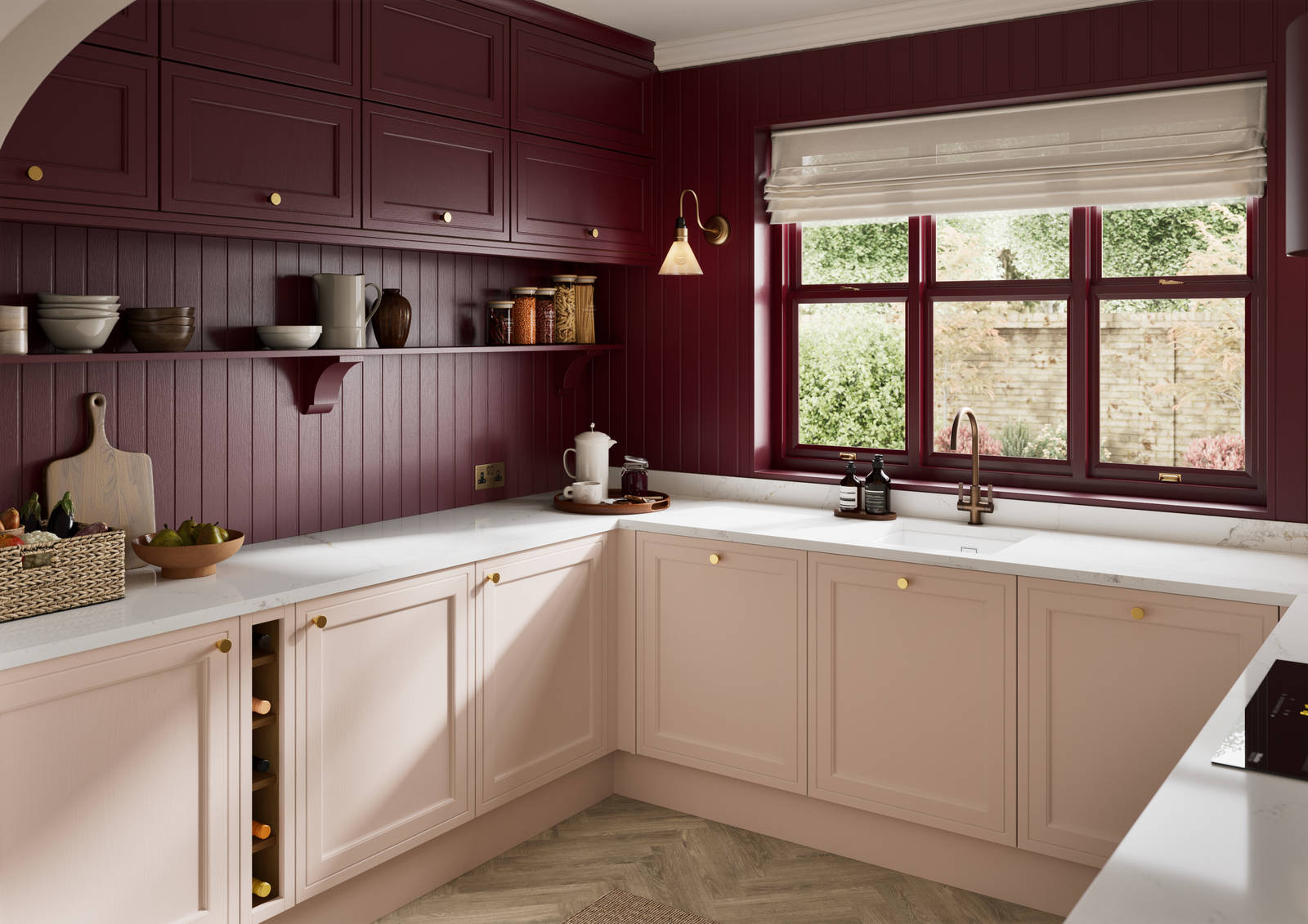 Painted wood grain Shaker style Bewdley kitchen with cabinets in light pink shade Chalk Blush, marbled worktop, brass knobs, red Morello wall-mounted cabinets with matching shelves and wall panel, built- in wine storage.