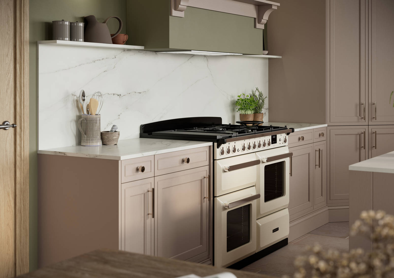 Gas range cooker in Shaker style painted wood grain Bewdley kitchen in neutral shade Cornish Clay, tall cabinets with marbled worktop and matching backsplash, traditional knobs and handles.