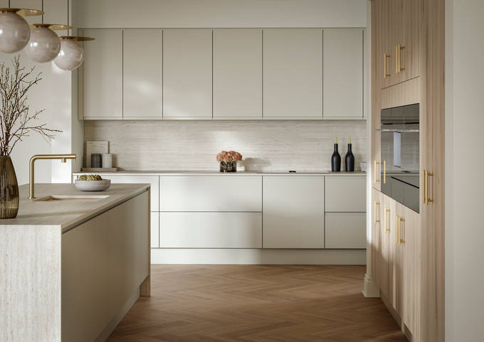 A bright and airy open-plan kitchen that incorporates Duxbury drawers and cabinets in Limestone, and Portobello units in Bosco.