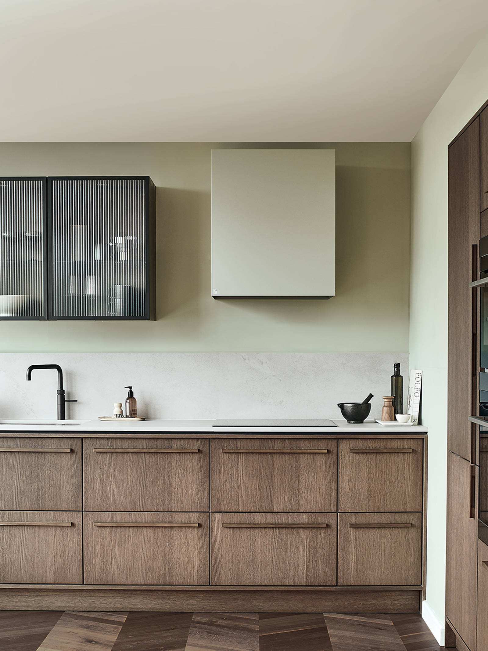 Nordic Nature. Modern wooden kitchen design with a Nordic influence. Featured floating worktops, a ribbed plinth and rounded end panels.