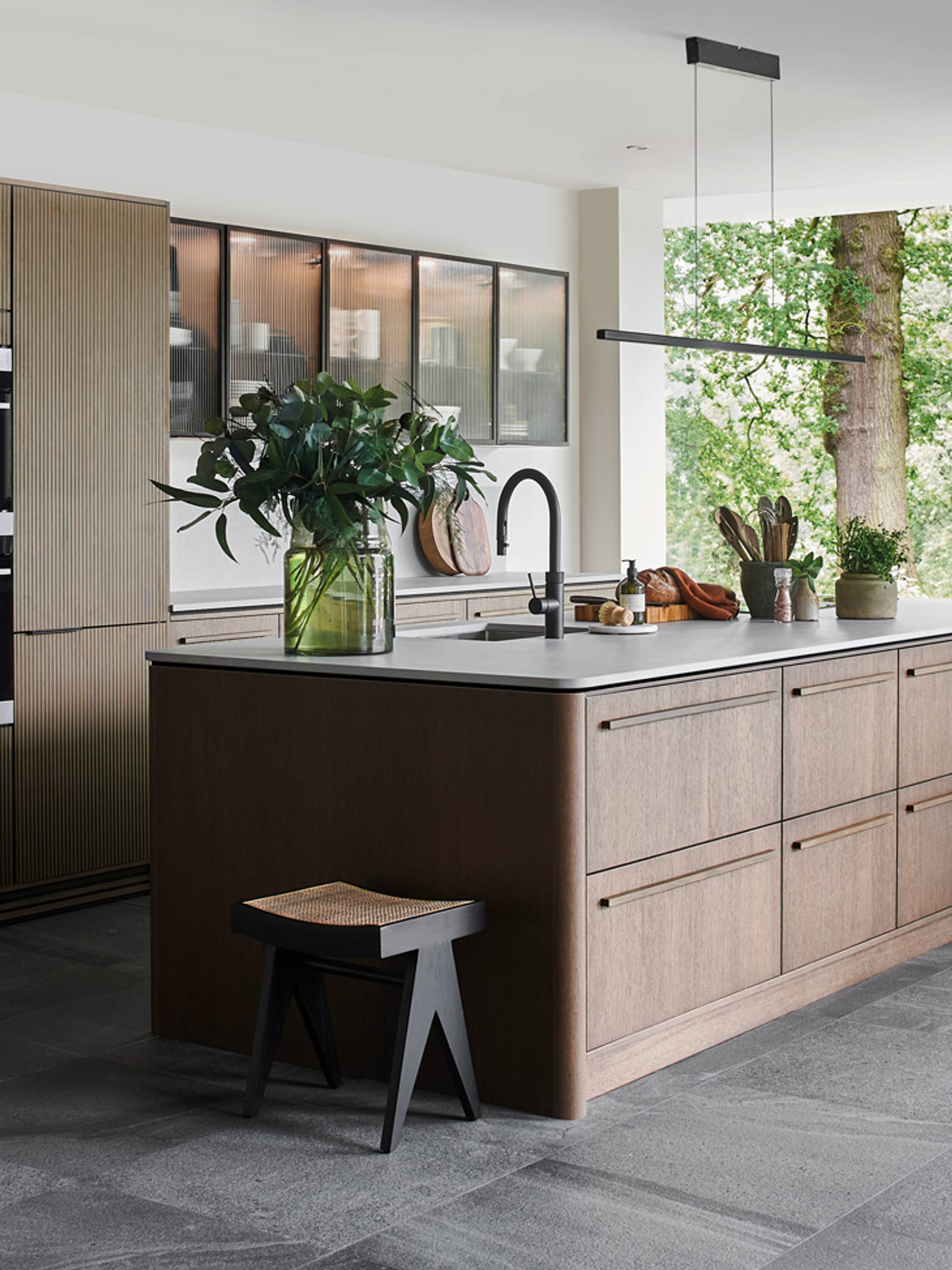 Nordic Nature. Modern wooden kitchen design with a Nordic influence. Featured floating worktops, a ribbed plinth and rounded end panels