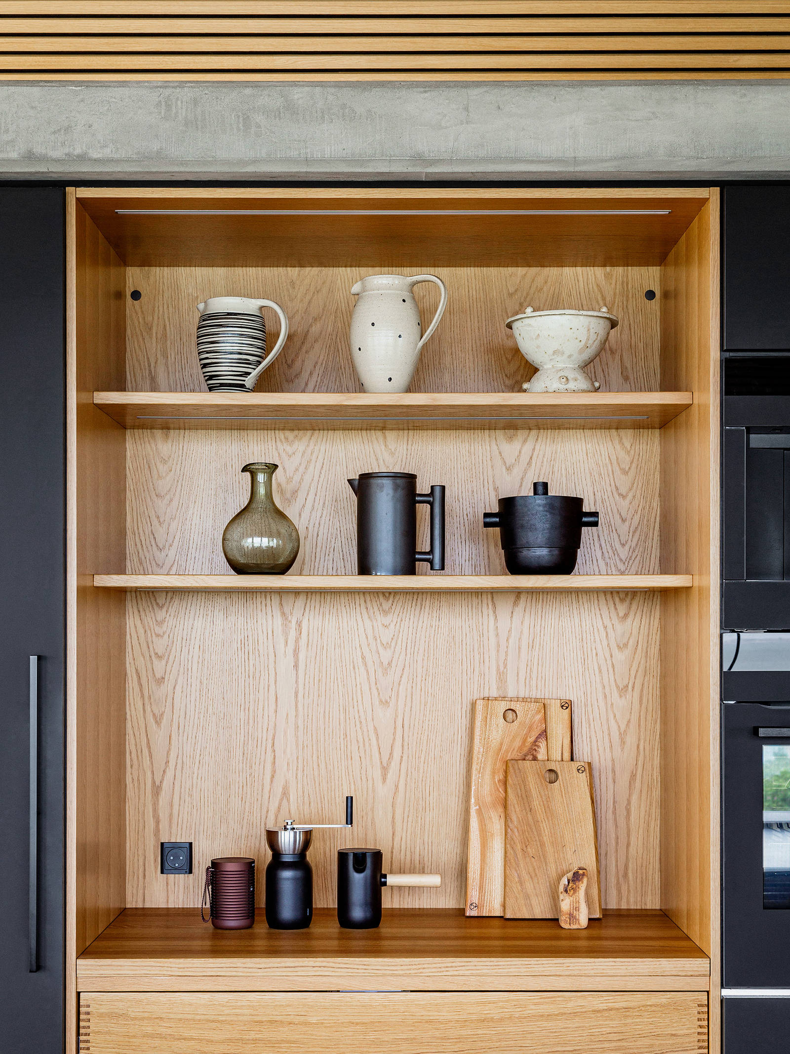 Selected pottery on display in the bespoke kitchen