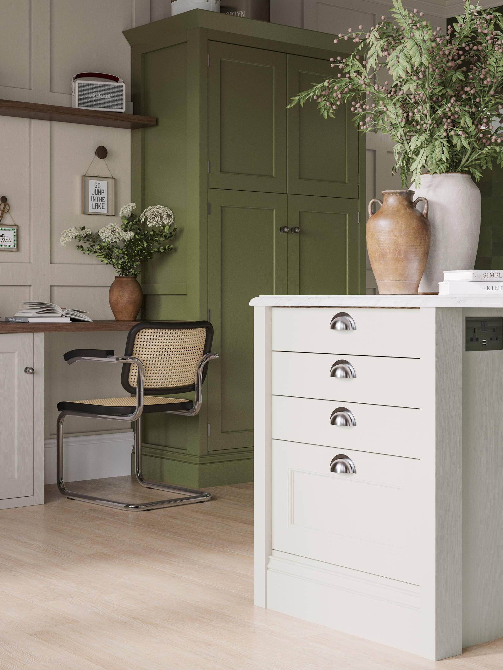 Off-white and olive green kitchen featuring shaker-style cabinetry and a desk area within the space.