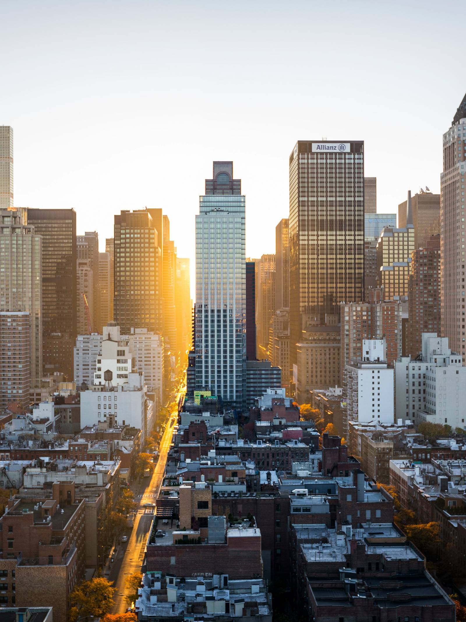 The New York city skyline with a sunset in the background.