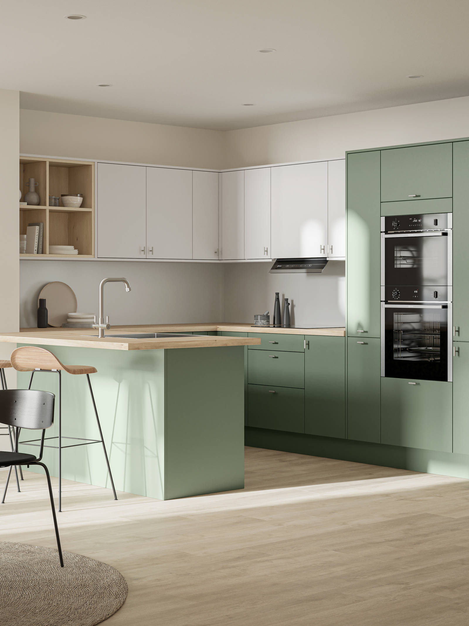 Contemporary scandinavian influenced Ascoli kitchen in fresh shade green Woodland and light grey, wall cabinets with timber accents like open shelves and oak laminate worktop, matched with oak laminate flooring and wood barstools at breakfast bar.