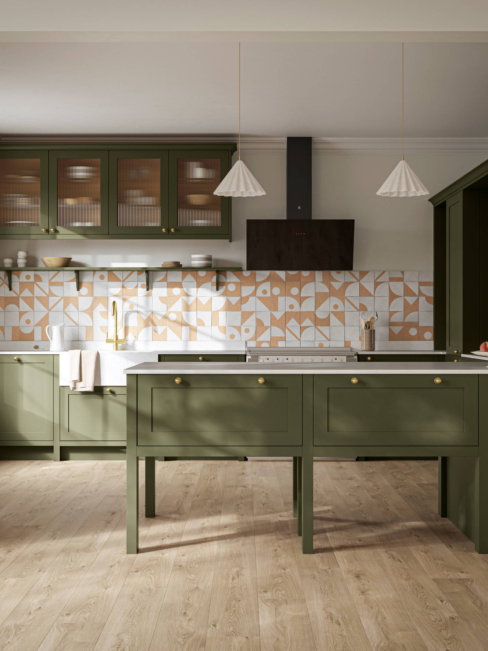 Premium Shaker kitchen Wardley Tailored green with traditional detailing, brass accessories, fluted glass wall vitrine cabinets, standalone Wardley Chalk Blush pantry, Classic Flint Grey oiled oak engineered wood flooring.