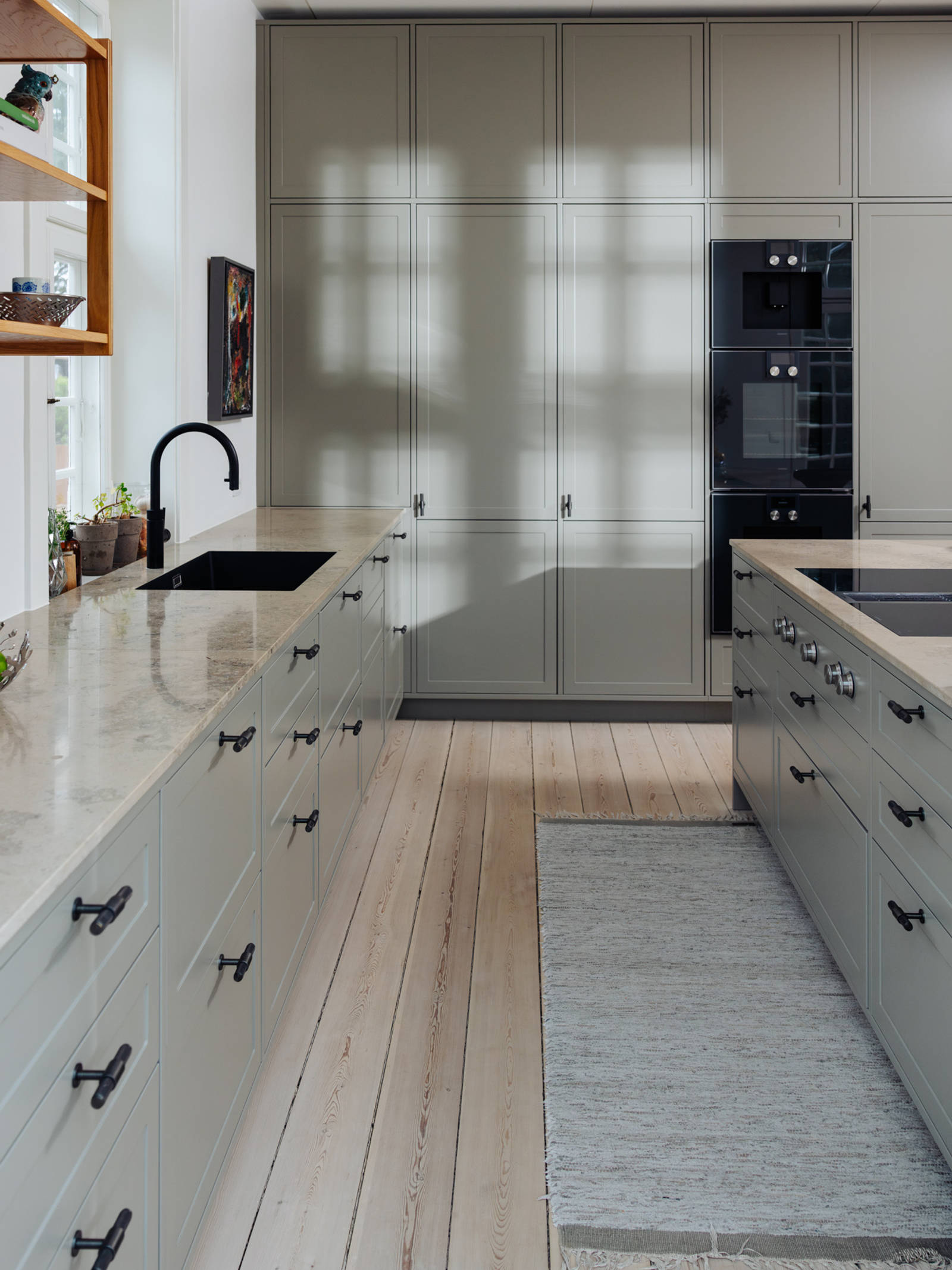 The tall cabinets maximize storage space in the kitchen.