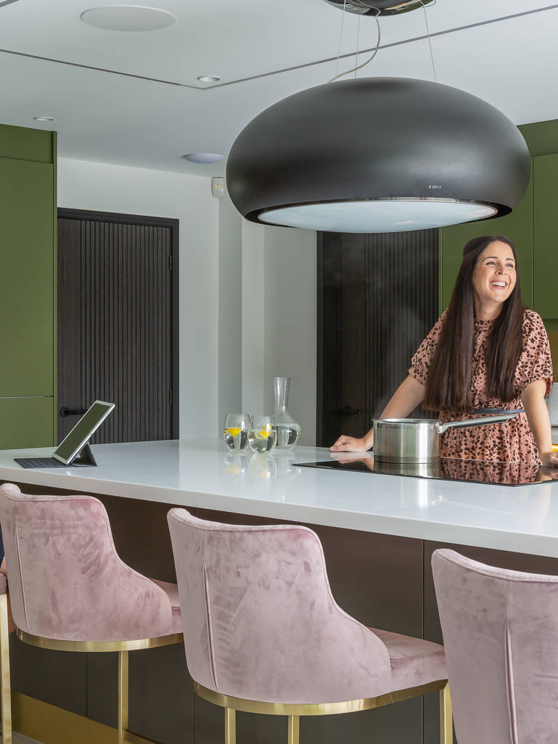 Kelly and James Godden in their calming and contemporary handleless kitchen Integra Soho in bright green and earthy brown from Magnet.