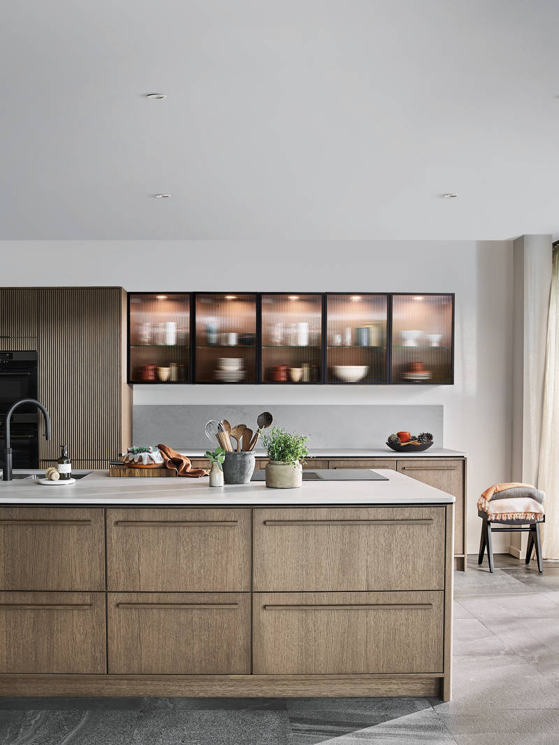 Nordic Nature. Modern wooden kitchen design with a Nordic influence. Featured floating worktops, a ribbed plinth and rounded end panels