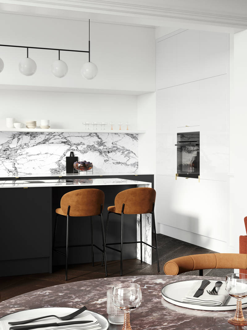 Minimal maximalism with Magnet's Hoxton kitchen in Sumi Black, combined with white marbled worktop and splashbacks and colourful interiors.