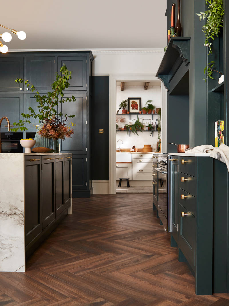 Ludlow, a traditional Shaker-style kitchen range featuring panelled doors with visible woodgrain and beading detail, in the shade Arboretum Green.