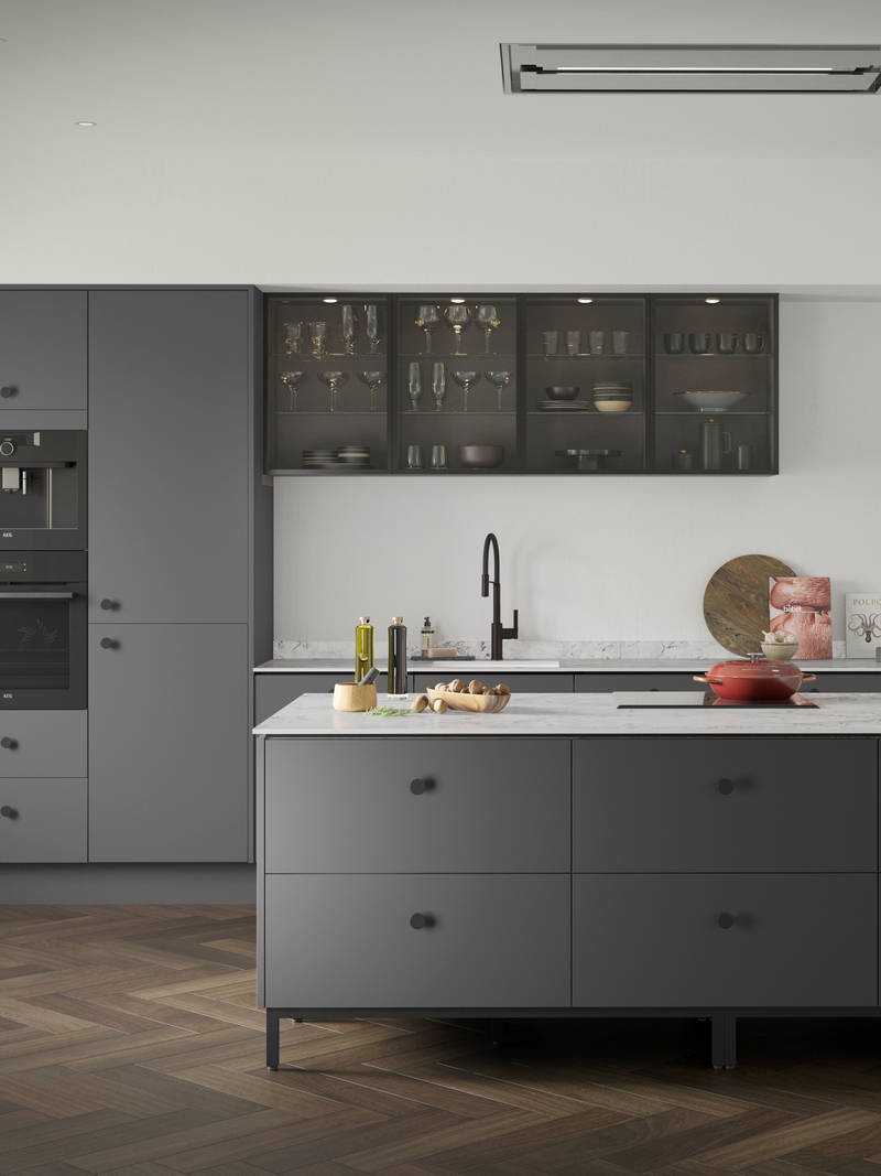 Soho Charcoals kitchen, a premium painted slab door from Magnet, with fluted glass Nordic Nature wall cabinets.