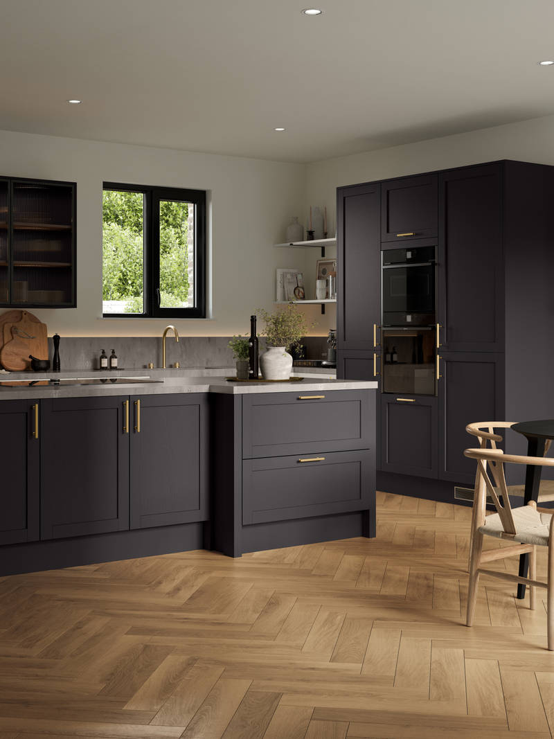 A contemporary Shaker kitchen with black cabinets and hardwood floors, paired with fluted glass cabinets.