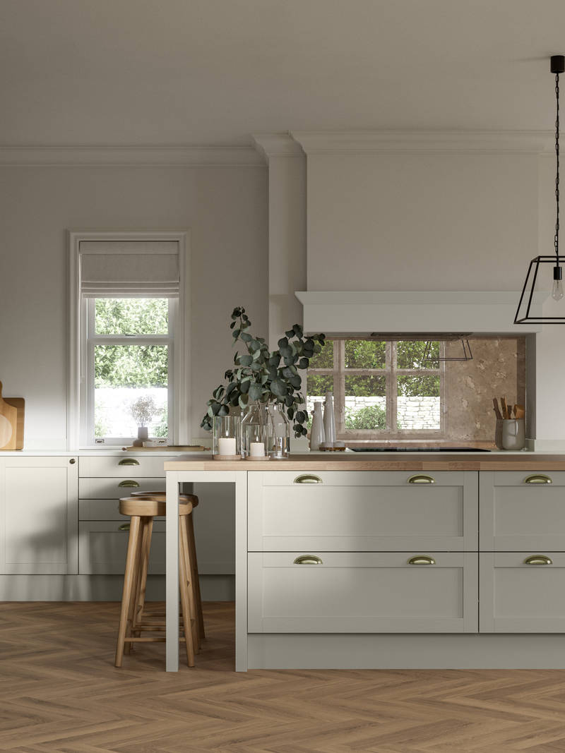 Ambleside kitchen range shown in a home kitchen with blue Shaker cabinets and wood floors.