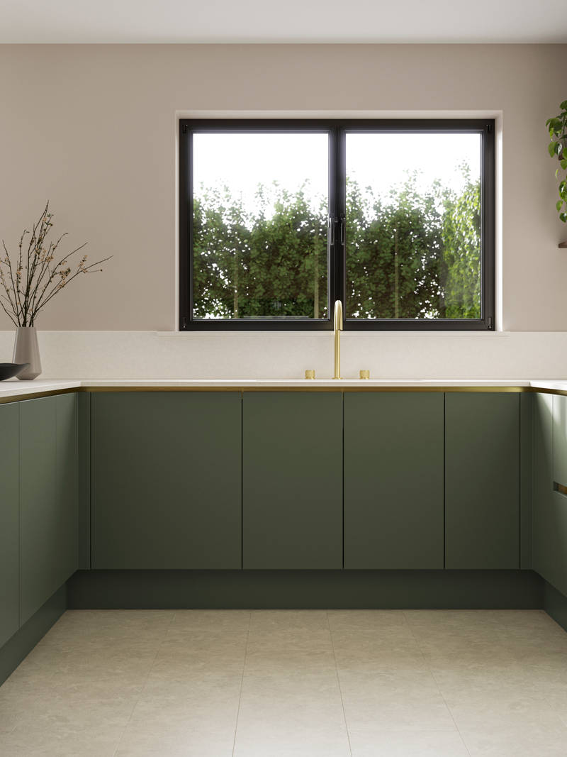 Painted handleless slab front Integra Soho from Magnet in shade Thyme paired with wall cabinets in shade Limestone, finished with brass details and plants.