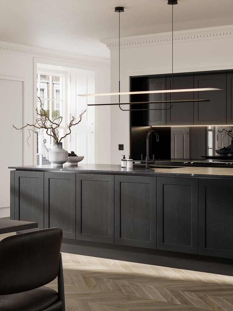 Handleless frame doors Integra Wardley Sumi black kitchen with kitchen island, Integra Soho Limestone tall cabinets with integrated ovens, black dining table and chairs, pale oak chevron flooring.