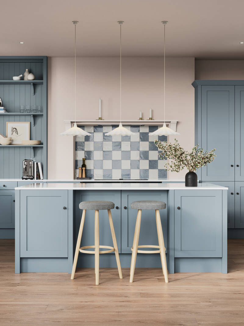 Premium Shaker kitchen Wardley Portland Blue including kitchen island with traditional detailing, black accessories, white worktop and matching blue open shelves with blue panelling and checkered tiling over range cooker.